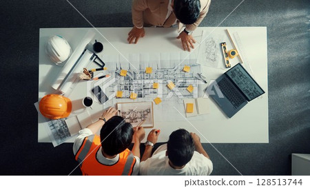 Top view of smart team pointing and discussing about construction. Alimentation. 128513744