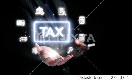 Hands Reaching to Illuminate the Concept of Tax with Digital Icons Representing Finance, Economy, and Administration in a Dark Background. Qubit Hands Reaching to Illuminate the Concept of Tax with Digital Icons Representing Finance, Economy, and Administration in a Dark Background. Qubit 128513825
