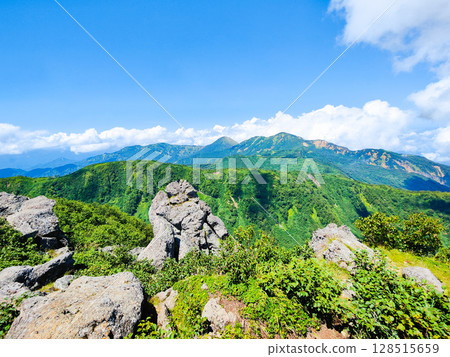 Climbing Mt. Myoko in summer (view of Mt. Yakeyama and Mt. Hiuchiyama from the top of the northern peak) Climbing Mt. Myoko in summer (view of Mt. Yakeyama and Mt. Hiuchiyama from the top of the northern peak) 128515659
