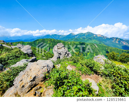 Climbing Mt. Myoko in summer (view of Mt. Yakeyama and Mt. Hiuchiyama from the top of the northern peak) Climbing Mt. Myoko in summer (view of Mt. Yakeyama and Mt. Hiuchiyama from the top of the northern peak) 128515661