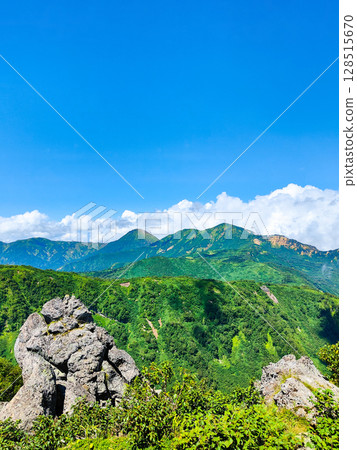 Climbing Mt. Myoko in summer (view of Mt. Yakeyama and Mt. Hiuchiyama from the top of the northern peak) 128515670