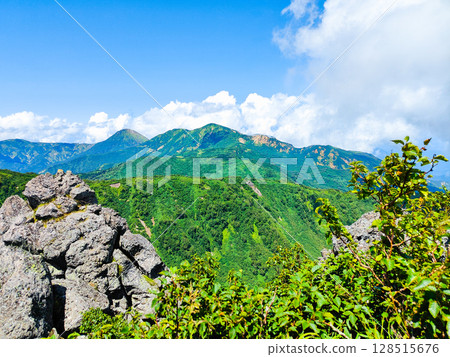 Climbing Mt. Myoko in summer (view of Mt. Yakeyama and Mt. Hiuchiyama from the top of the northern peak) 128515676