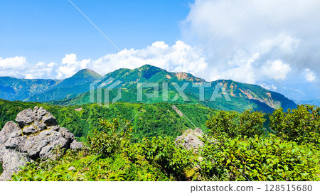 Climbing Mt. Myoko in summer (view of Mt. Yakeyama and Mt. Hiuchiyama from the top of the northern peak) Climbing Mt. Myoko in summer (view of Mt. Yakeyama and Mt. Hiuchiyama from the top of the northern peak) 128515680