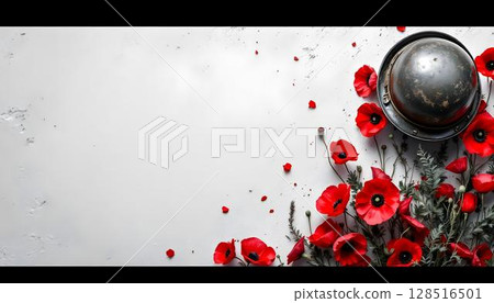 A red poppy and a helmet on a white marble surface, honoring military sacrifice and freedom on Memorial day 128516501