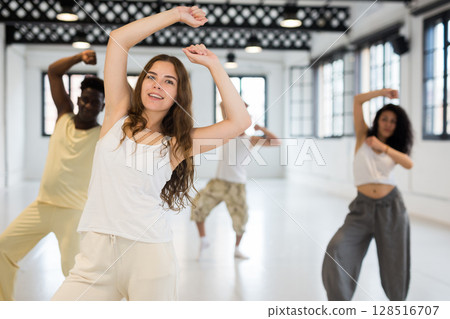 Young beautiful female dancer enjoying dancing break dance Young beautiful female dancer enjoying dancing break dance 128516707