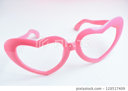 pink heart shape of glasses on white background pink heart shape of glasses on white background 128517409