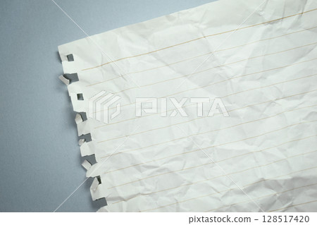 crumpled line paper texture on grey background,  blank sheet notebook 128517420