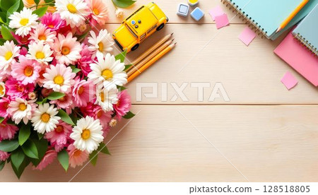A wooden background with spring flowers and school supplies, reflecting themes of education, mentorship, and teacher appreciation 128518805
