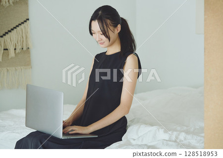 Woman doing telework at home 128518953
