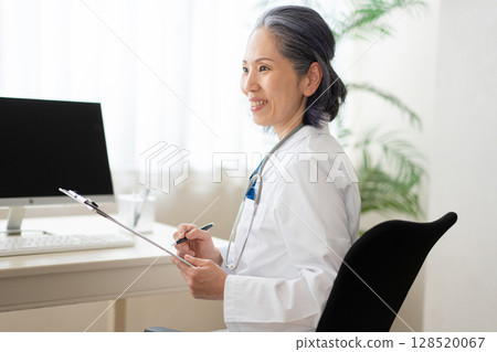 Doctor examining a patient 128520067