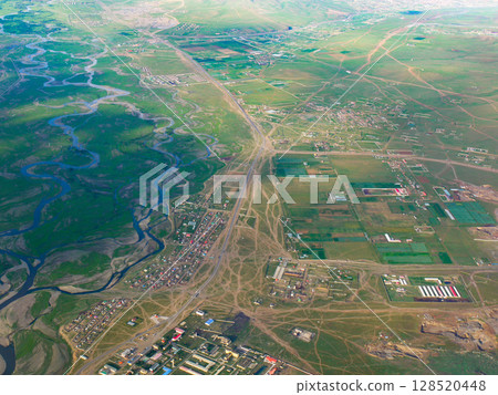 Grassland seen from inside an aircraft taking off from Ulaanbaatar Airport, Mongolia 128520448