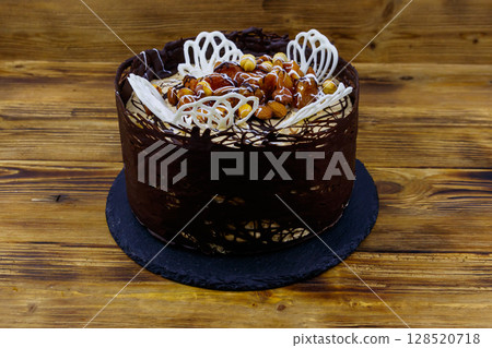 Tasty chocolate cake on a wooden table 128520718