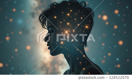 Conceptual illustration showing woman's silhouette filled with glittering stars against a soft bokeh background creating abstract representation of dreams and thoughts Conceptual illustration showing woman's silhouette filled with glittering stars against a soft bokeh background creating abstract representation of dreams and thoughts 128522078