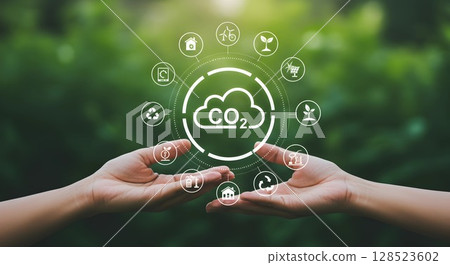 Reduce CO2 emission concept, hand holding a green eco sign 128523602