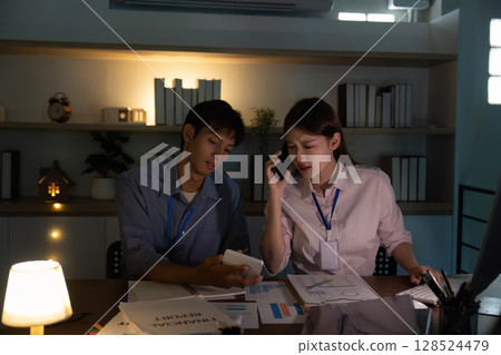 Team Discussion. Professionals collaborating on project strategies in a modern office setting. Team Discussion. Professionals collaborating on project strategies in a modern office setting. 128524479