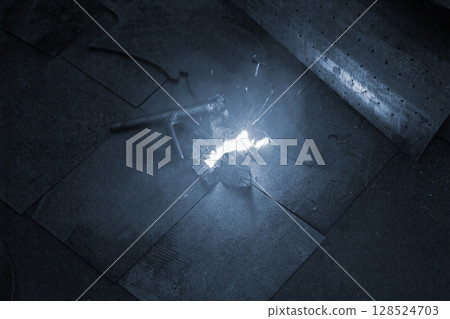 Laser cleaning of metal surfaces. Laser cleaning metal from rust. Glowing laser beam cleaning metal from rust. Laser removes removing old rust from metal. Innovation metalworking. New technologies 128524703