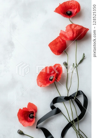 Red Poppies on Light Background with Black Ribbon 128525350