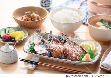 A steaming Japanese breakfast of dried horse mackerel with mirin and rice A steaming Japanese breakfast of dried horse mackerel with mirin and rice 128525465
