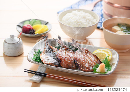 A steaming Japanese breakfast of dried horse mackerel with mirin and rice A steaming Japanese breakfast of dried horse mackerel with mirin and rice 128525474
