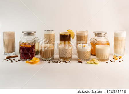 An assortment of seasonal beverages such as sea buckthorn tea, lattes, and apple drinks with cinnamon on display An assortment of seasonal beverages such as sea buckthorn tea, lattes, and apple drinks with cinnamon on display 128525518
