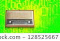 front old brown and white radio on blur numbers stack of various sizes and speed laser on green and yellow background, maths, business, copy space 128525667