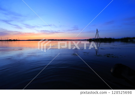Asahi reflected on the surface of the water Asahi reflected on the surface of the water 128525698