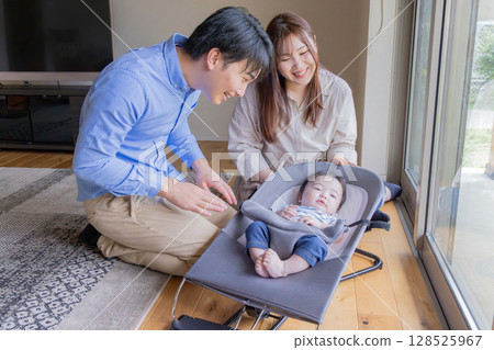 A couple who babies a baby A couple who babies a baby 128525967