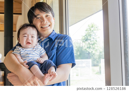 Child nurse holding a baby 128526186
