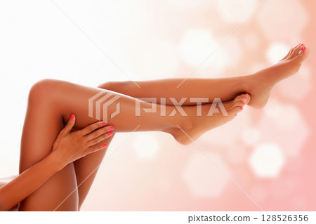 Long female legs after depilation, abstract blurred background 128526356