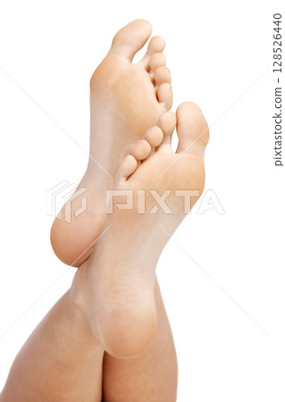 Closeup shot of female feet, isolated on white background 128526440