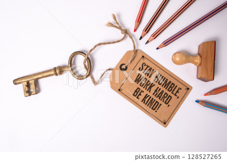 Stay Humble, Work Hard, Be Kind. Motivational Message Tag with Vintage Key and Colored Pencils on 128527265