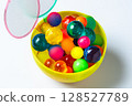 Colorful super balls and poi in a cup 128527789