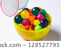 Colorful super balls and poi in a cup 128527793