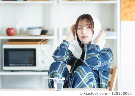A woman relaxing in the room 128530093