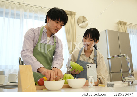 A couple standing in the kitchen A couple standing in the kitchen 128530474