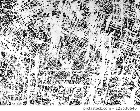 Intricate patterns emerge from chaotic lines scratched onto a flat surface, showcasing a combination of black and white colors creating depth and texture in an indoor setting. 128530640