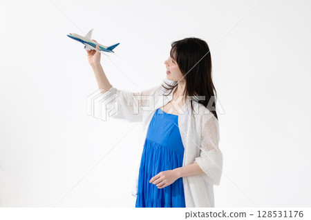 Middle-aged woman travel airplane 128531176