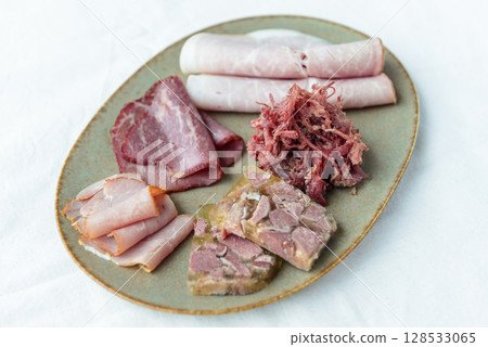 Ham, corned beef and meat terrine on a plate Ham, corned beef and meat terrine on a plate 128533065
