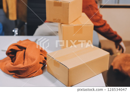 Portrait of Starting small businesses SME owners, two Asian woman check online orders Selling products working with boxs freelance work at home office, sme business online small medium enterprise Portrait of Starting small businesses SME owners, two Asian woman check online orders Selling products working with boxs freelance work at home office, sme business online small medium enterprise 128534047