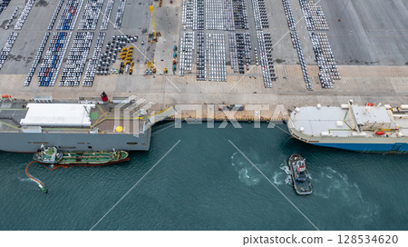 Aerial view vehicles carrier and new cars for import export transportation logistic, Vehicles carrier at industrial RoRo terminal port, Vehicles carrier global business logistic import export new car 128534620