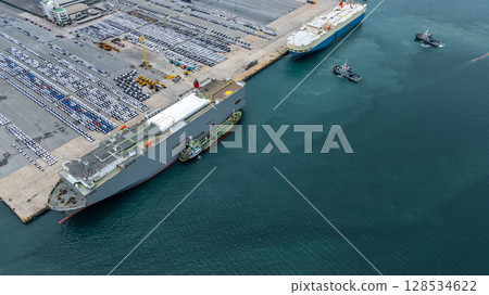 Aerial view vehicles carrier and new cars for import export transportation logistic, Vehicles carrier at industrial RoRo terminal port, Vehicles carrier global business logistic import export new car Aerial view vehicles carrier and new cars for import export transportation logistic, Vehicles carrier at industrial RoRo terminal port, Vehicles carrier global business logistic import export new car 128534622
