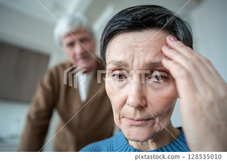 Portrait of depressed woman exhausted from dealing with husband hysterics in troubled marriage 128535010