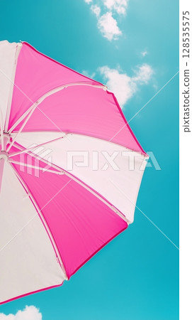 Umbrella pink and white beach for sunburn protection and blue sky bottom view 128535575