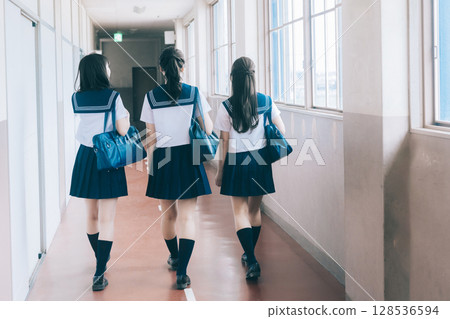 High school girl walking in the school corridor 128536594