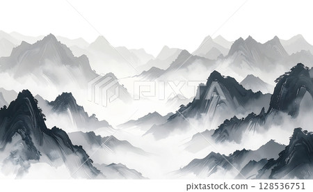 A snow-covered Japanese castle stands in a mountainous forest landscape in winter under a cloudy blue sky 128536751