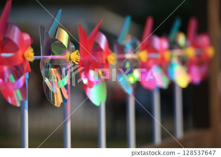 Colorful windmills A row of colorful windmills 128537647