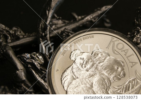 Silver investment coins on silver pieces. Australian 1 dollar koala 2023. 128538073