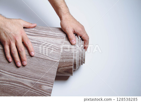 Waterproofness of linoleum. Waterproof linoleum in the kitchen. Sample roll. 128538285