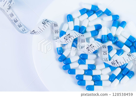 Weight loss pills. Obesity treatment. Overweight problems. 128538459