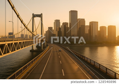 沐浴在傍晚燈光下的吊橋和城市摩天大樓 沐浴在傍晚燈光下的吊橋和城市摩天大樓 128540896